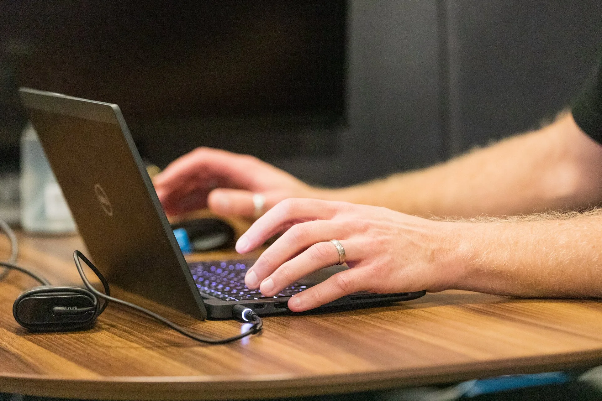 Hands typing on keyboard