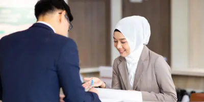 two people in reception connecting to guest wifi