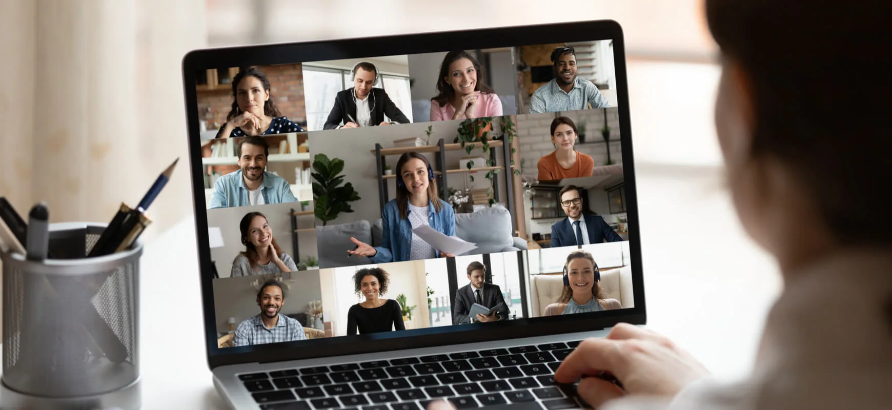 worker in front of laptop on teams call