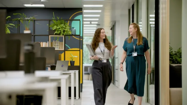 ramsac office team members walking conversation